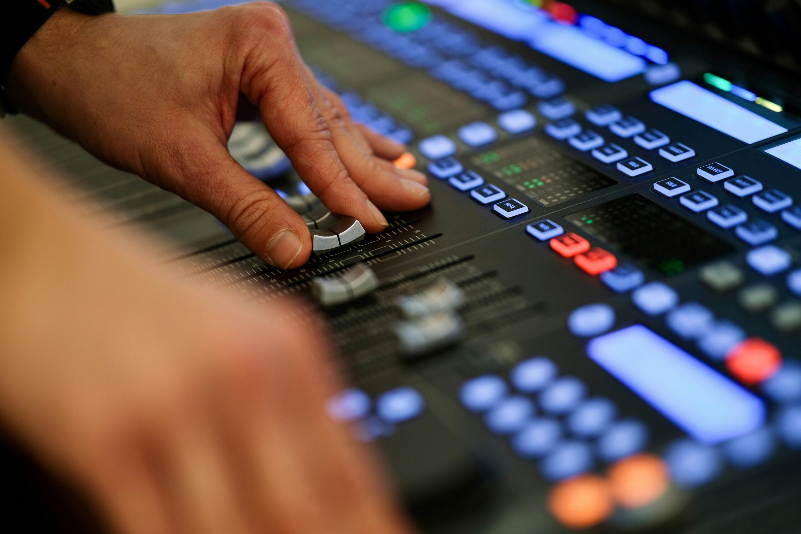 Hands using DJ equipment