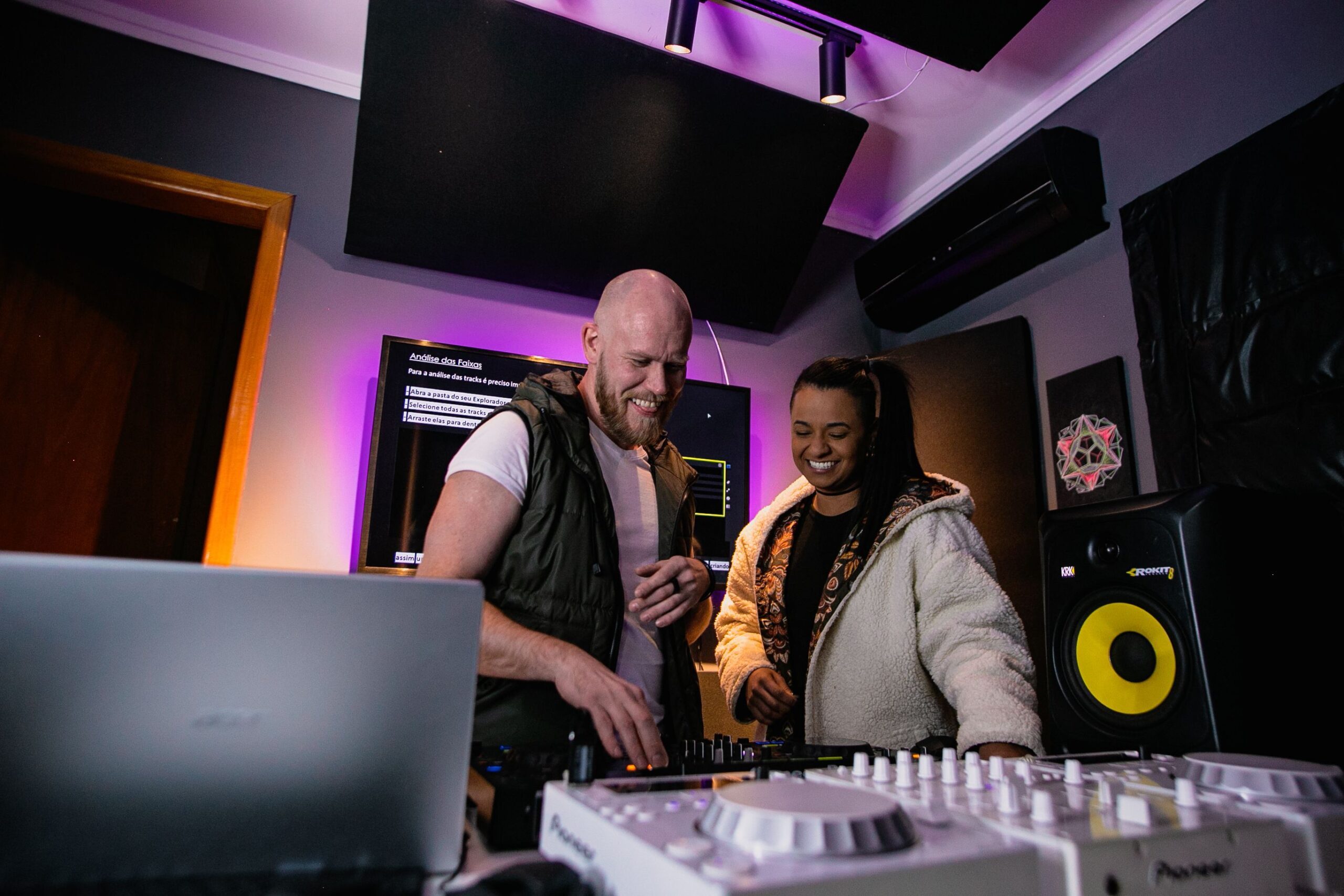 People creating music together in a studio