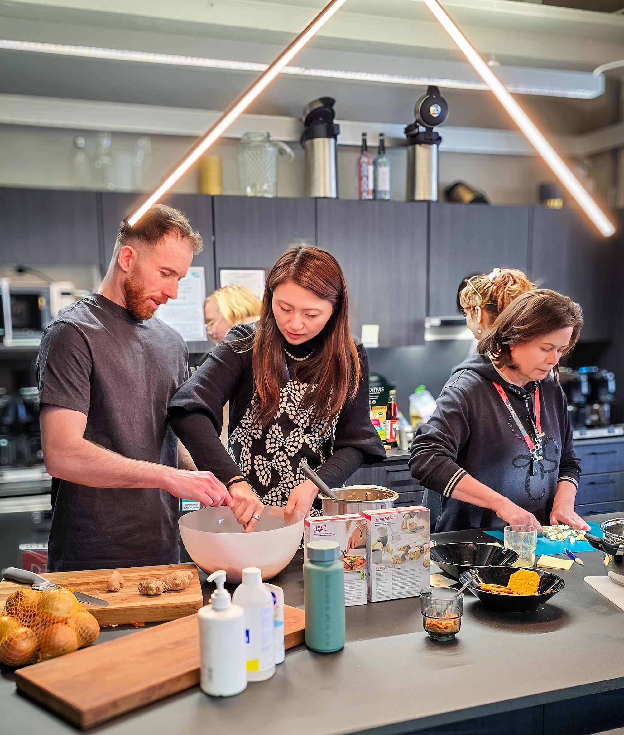 Participants preparing food together during a dumpling workshop.