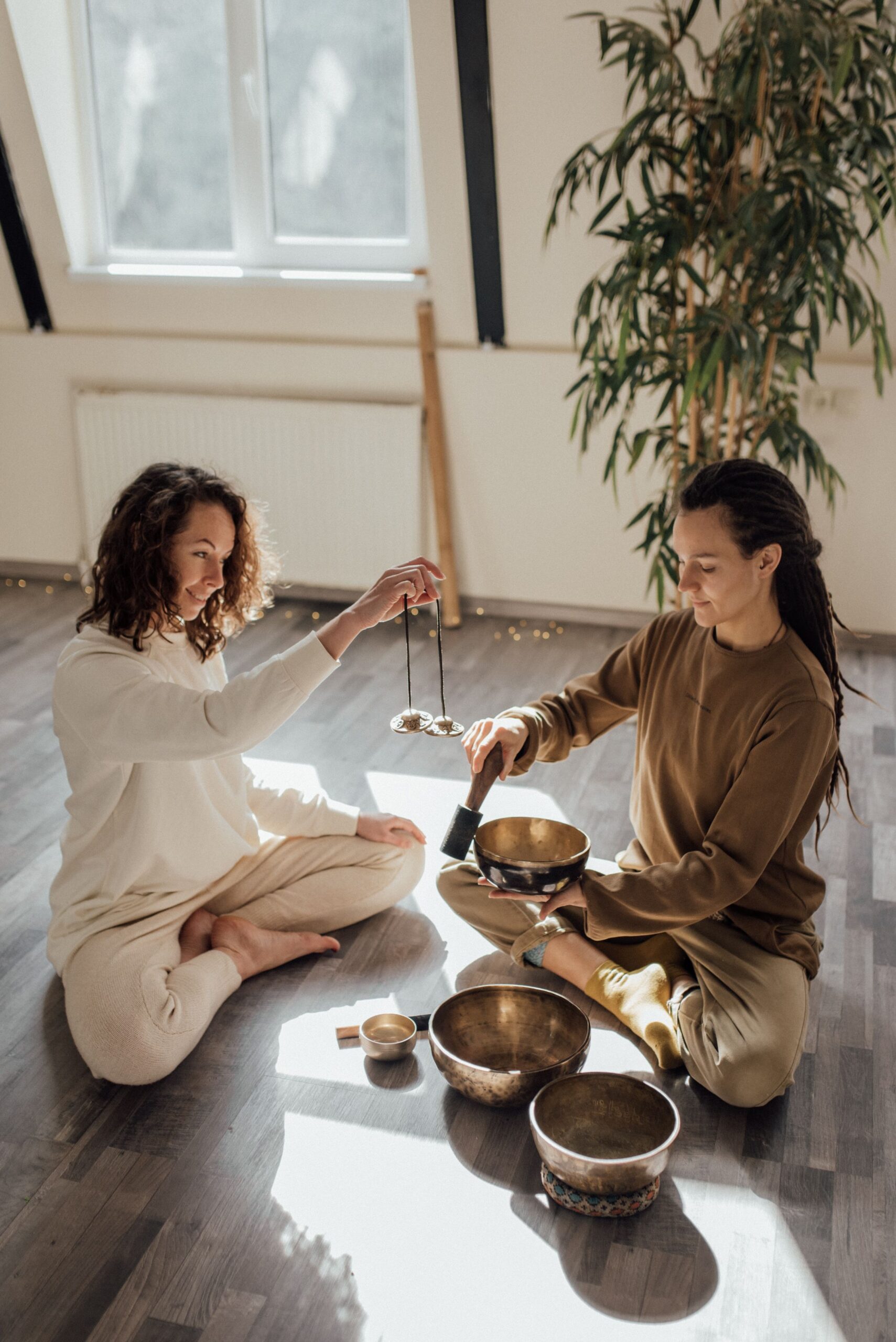 Participants experiencing singing bowls and sound meditation