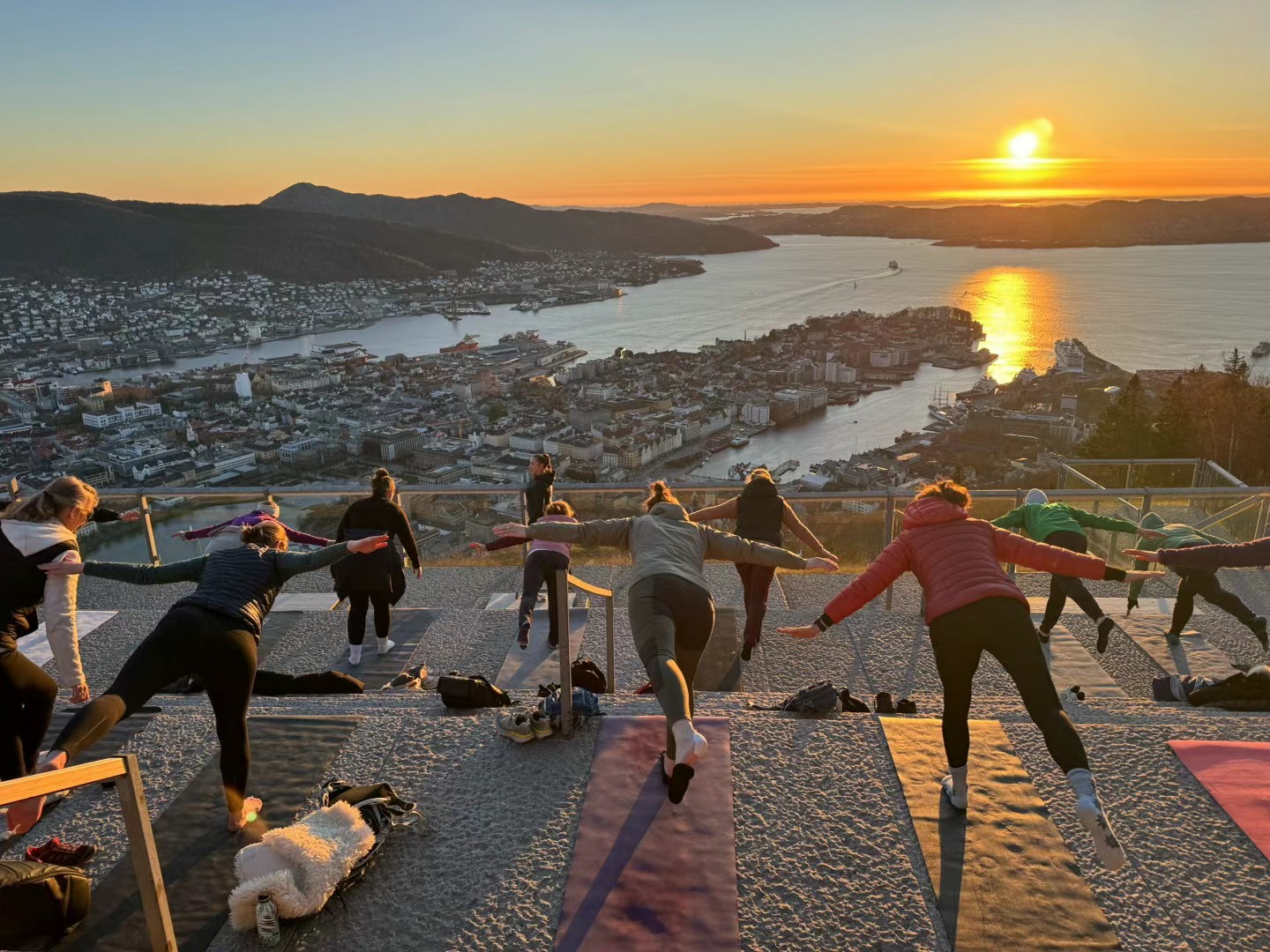 People exercising outdoors at sunset
